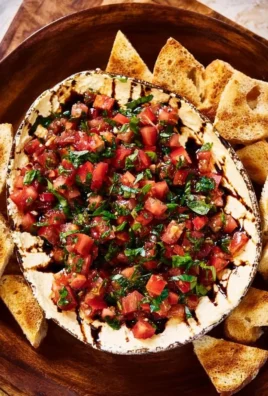 Delicious bruschetta dip served with toasted bread slices